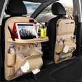 Beige PU leather car seat-back organizer with fold-down tray in vehicle