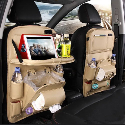 Beige PU leather car seat-back organizer with fold-down tray in vehicle